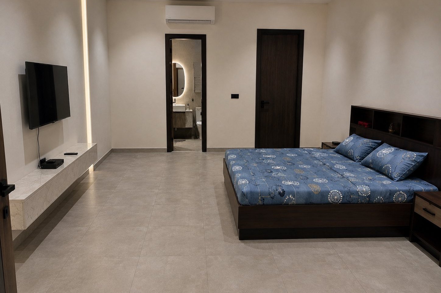 The bedroom, king bed and en-suite beyond